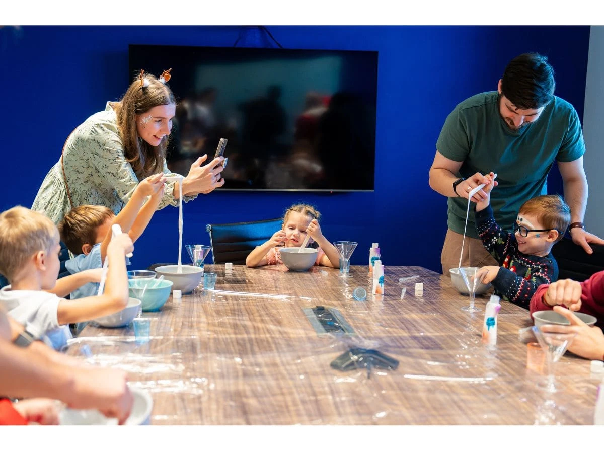 Children with their parents making slime at a party organized by CyprusShows