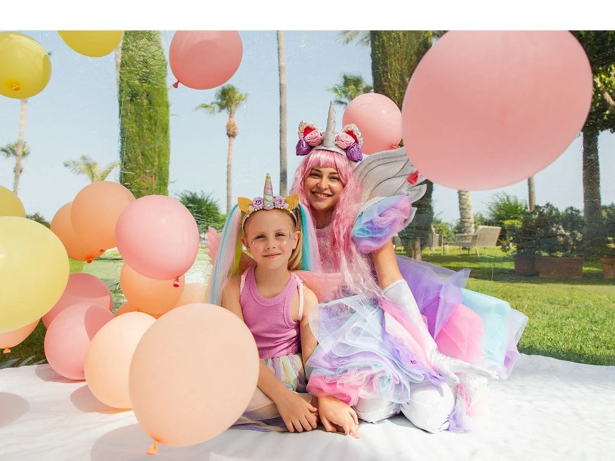 An animator with the birthday girl at a birthday party by Cyprus Shows
