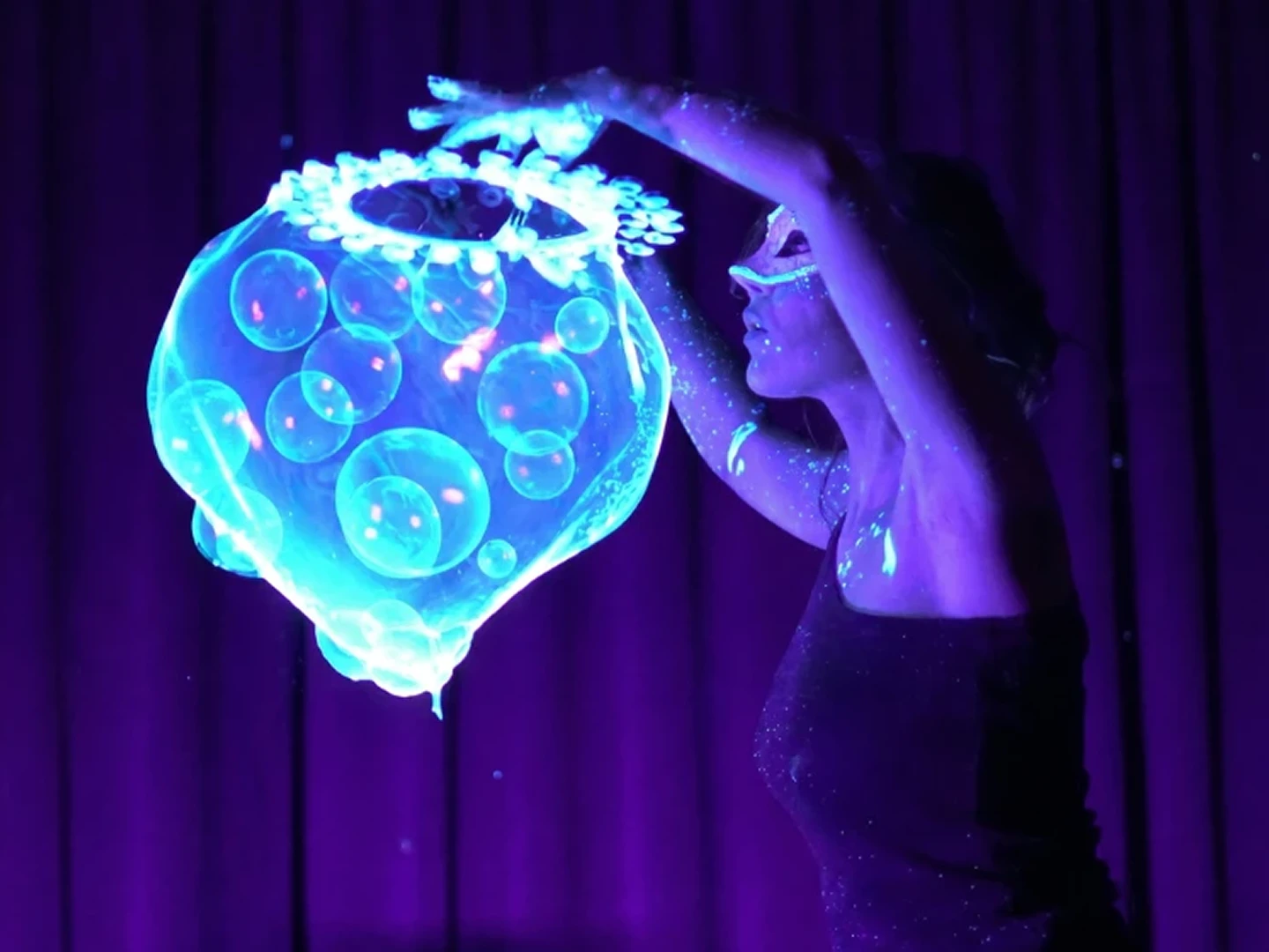 Bubble show performer creating a wall of giant soap bubbles during a wedding ceremony entrance in Limassol.