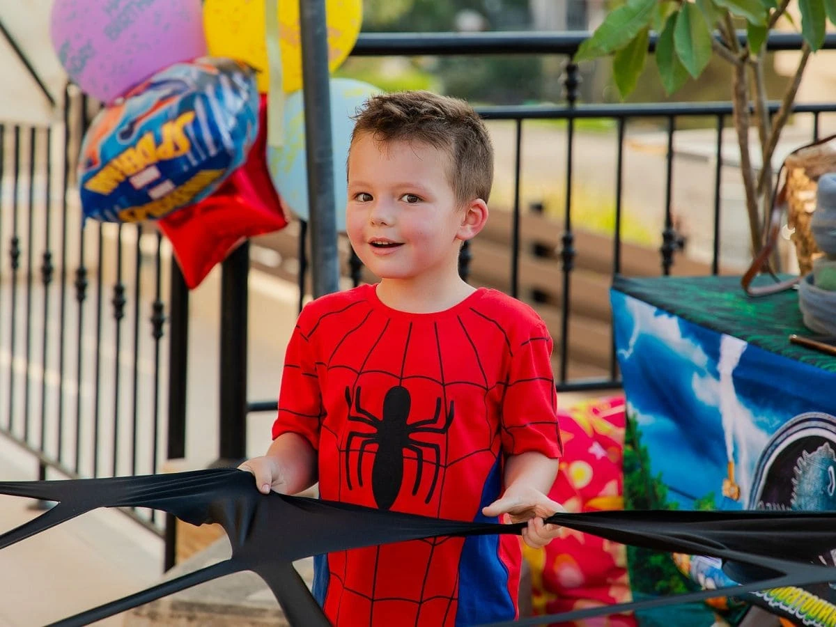 A boy in a Spider-Man costume