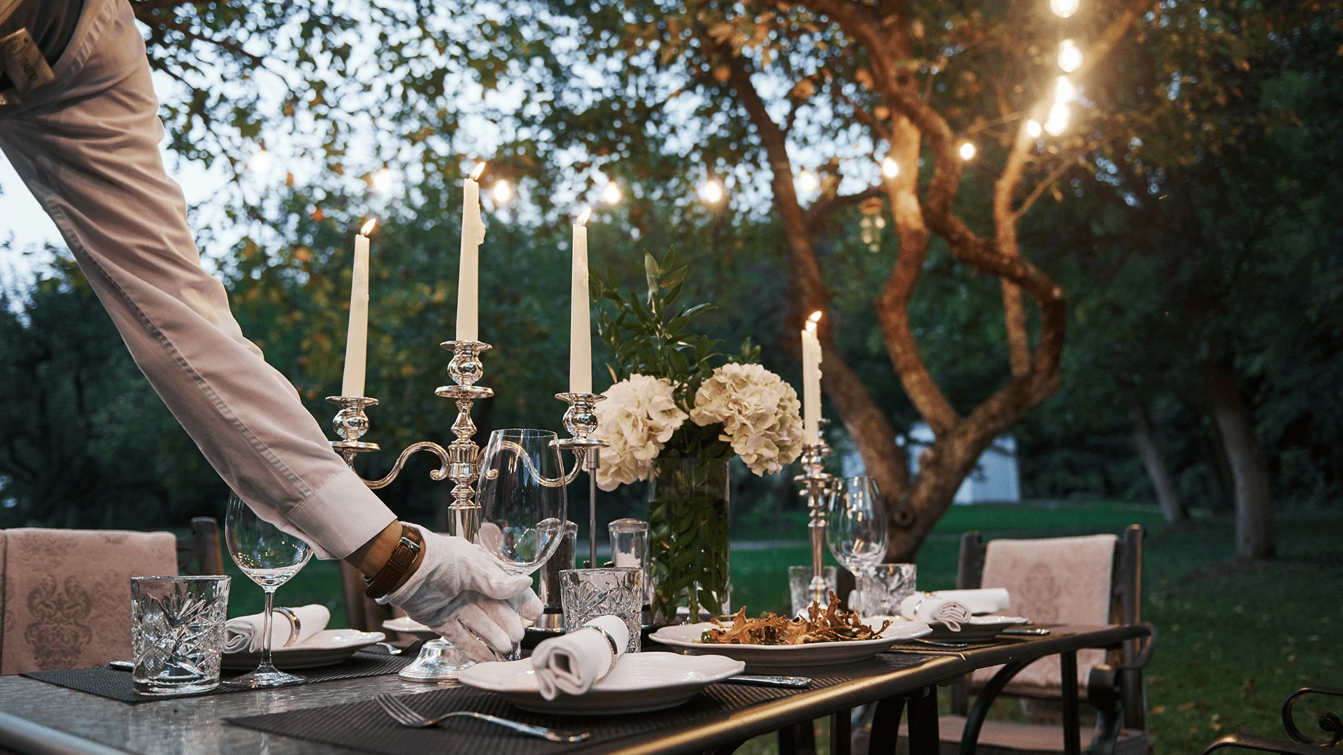 Intimate welcome dinner beside an infinity pool during a multi-day villa wedding weekend in Cyprus.