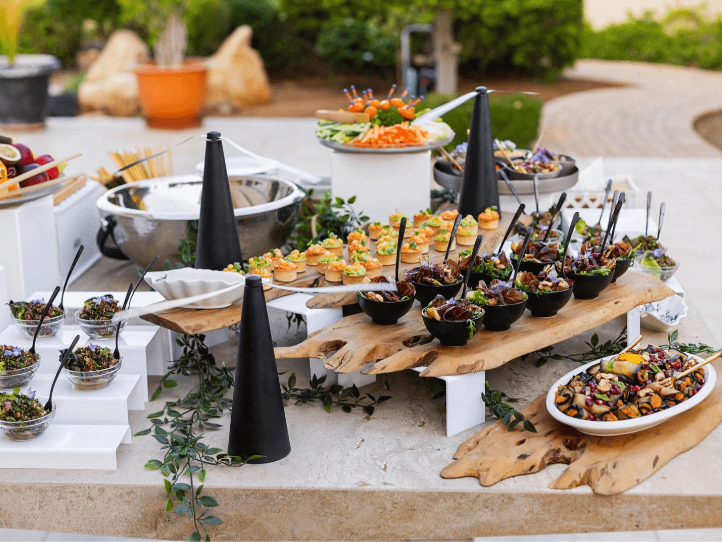 Off-site strategic session at a private villa in the hills above Limassol — a workspace on a terrace overlooking the coast.